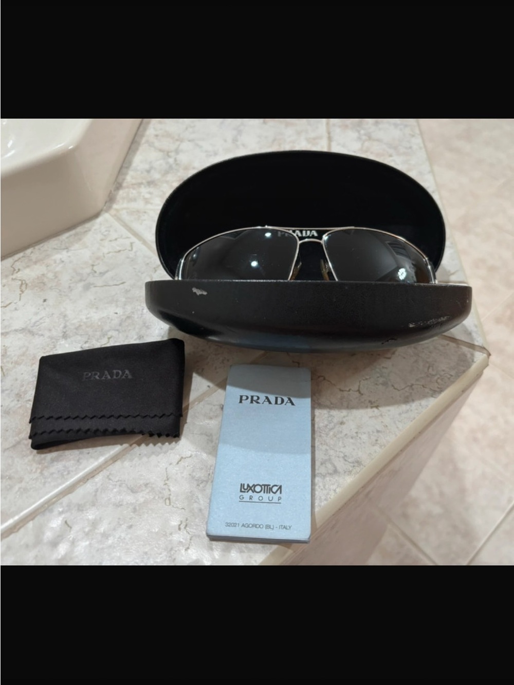 Prada Silver Frame Aviator Sunglasses with Black Lenses